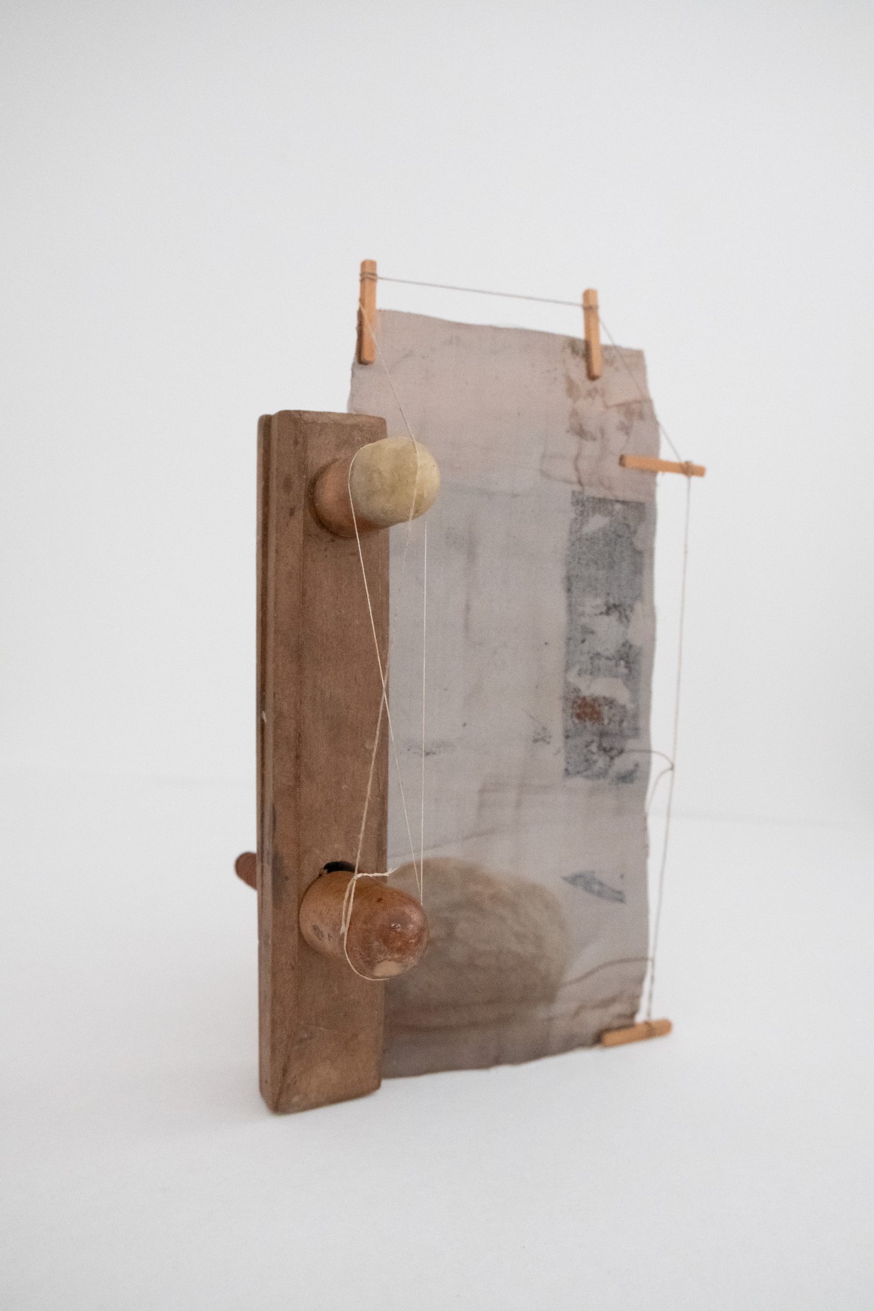 'Receiver' . edited wooden clamp, beeswax, copper gauze, dowel, thread, limestone . 22cm (h)